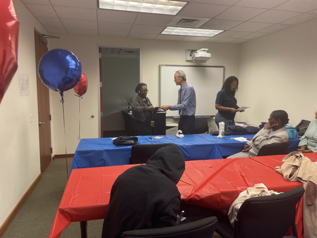 A Pr.E.P school graduate receiving a diploma