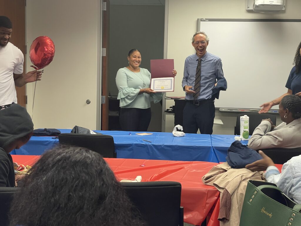 A Pr.E.P school graduate receiving a diploma