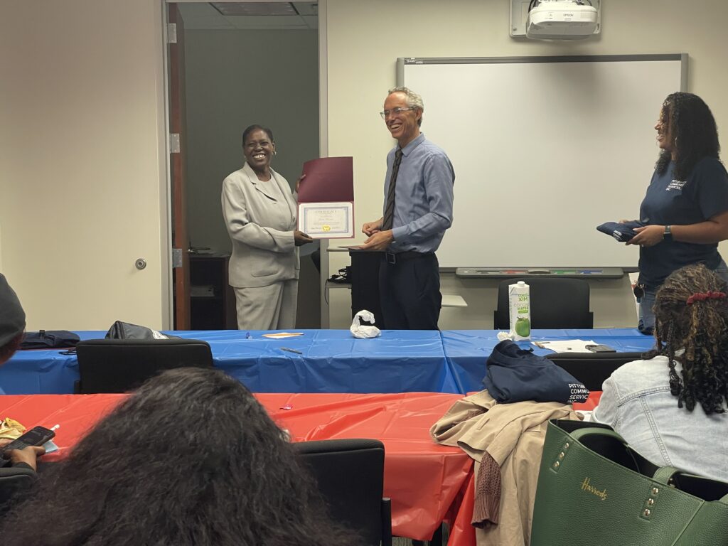 A Pr.E.P school graduate receiving a diploma