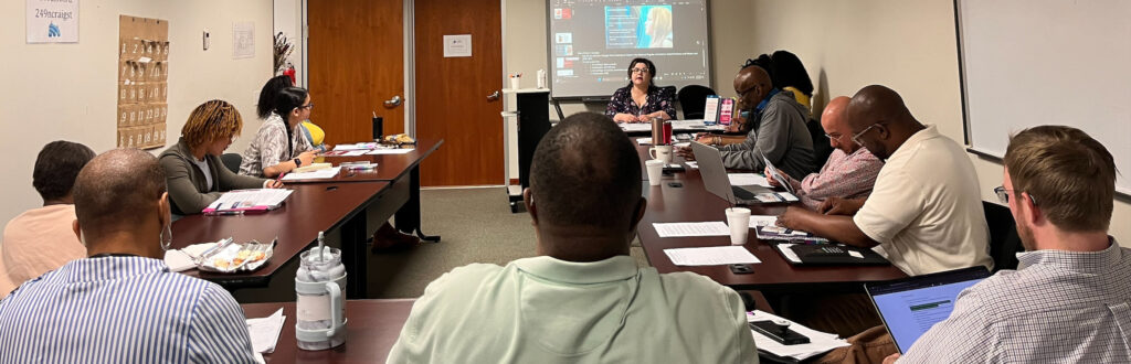 PCSI staff participating in QPR suicide prevention training at the North Craig Street office.