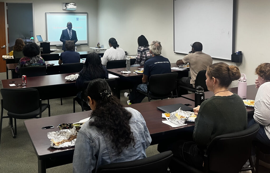 Judge Petite speaks with PCSI staff at Lunch & Learn.