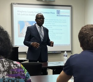 Judge Petite speaks with PCSI staff at Lunch & Learn.